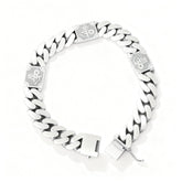 Silver chain bracelet with engraved design on a white background