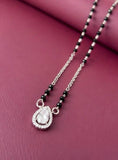 Necklace with a teardrop pendant on a pink background