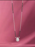 Necklace with a teardrop pendant on a pink background