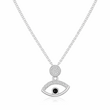 Silver necklace with an eye-shaped pendant on a white background