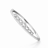 Silver bracelet with heart designs on a white background