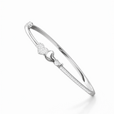 Silver bracelet with heart design on a white background