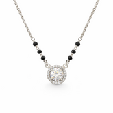 Necklace with a round pendant and black beads on a white background