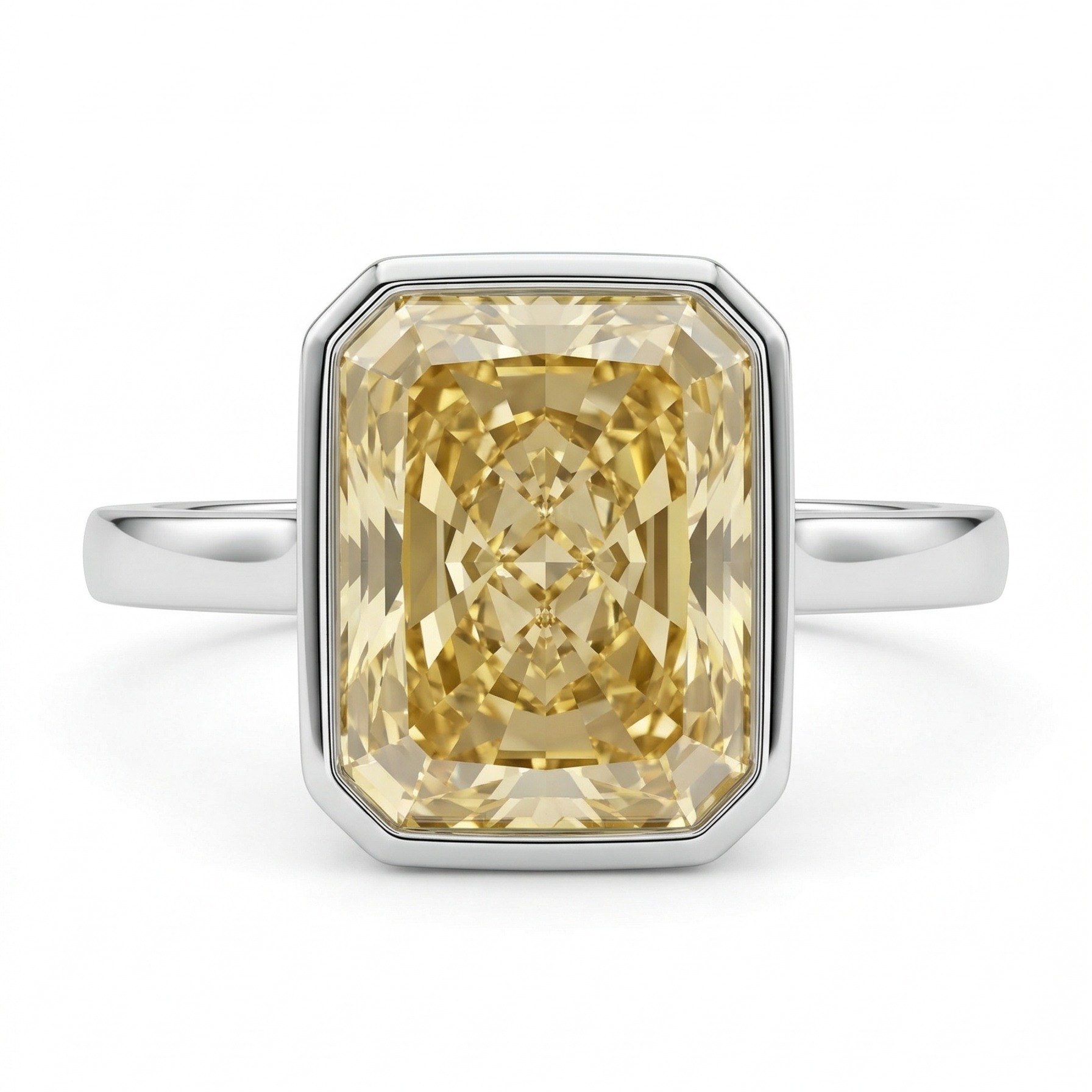 Ring with a yellow gemstone in a silver setting on a white background