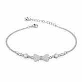 Silver bracelet with bow-shaped charms on a white background