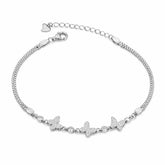 Silver bracelet with butterfly charms on a white background