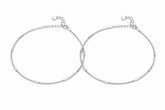 Two silver payals on a white background