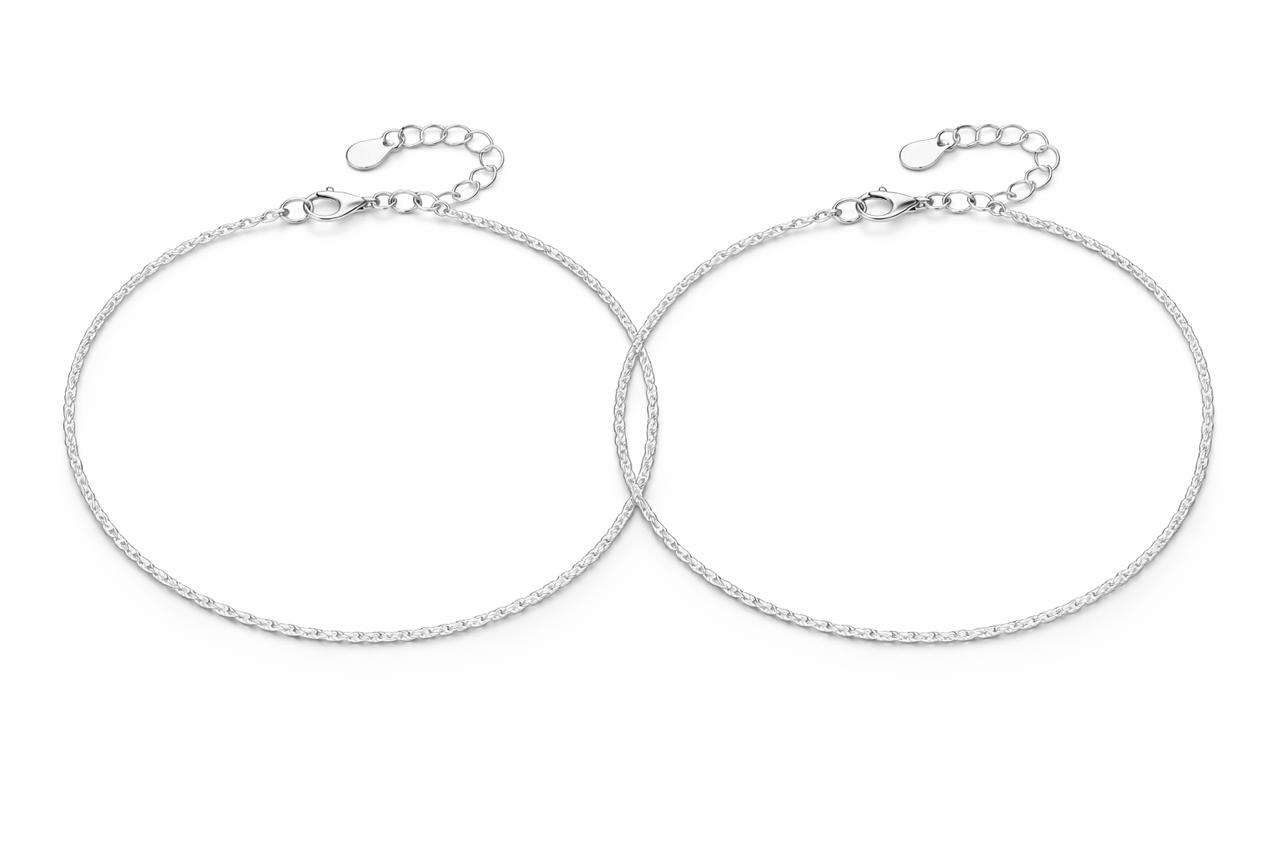 Two silver payal on a white background