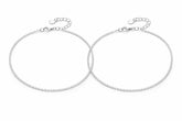Two silver payal on a white background