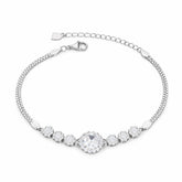 Silver bracelet with clear gemstones on a white background