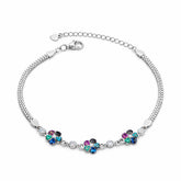 Silver bracelet with colorful gemstones on a white background