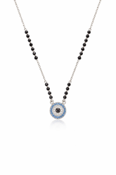mangalsutra with black beads and a blue evil eye pendant on a white background