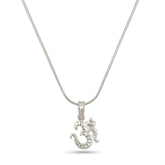Silver necklace with a detailed om pendant on a white background
