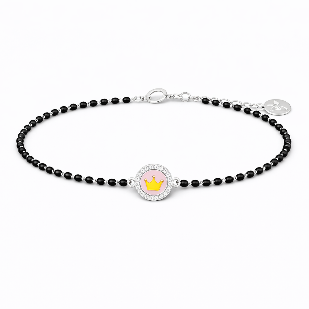 Black beaded bracelet with a round charm featuring a pink flower and gold crown on a white background.