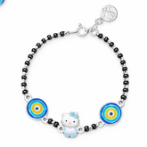 Bracelet with black beads, blue and yellow circular charms, and a Hello Kitty charm on a white background.