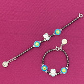silver Bracelet with colorful charms on a pink background