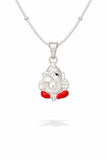 Silver pendant with red accents on a white background