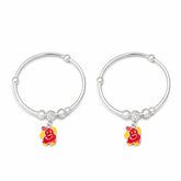 silver baby kada with ganesha charms on a white background