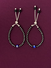 Pair of beaded bracelet on a purple background