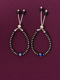 Pair of beaded bracelet on a purple background