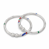 silver bangles with colorful meena on a white background