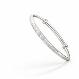 Silver bracelet with small diamonds on a white background