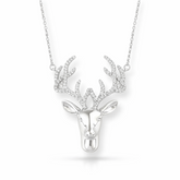 Silver deer head necklace on a white background