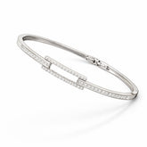 Silver bracelet with small diamonds on a white background