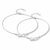 Two silver anklet with infinity symbols on a white background