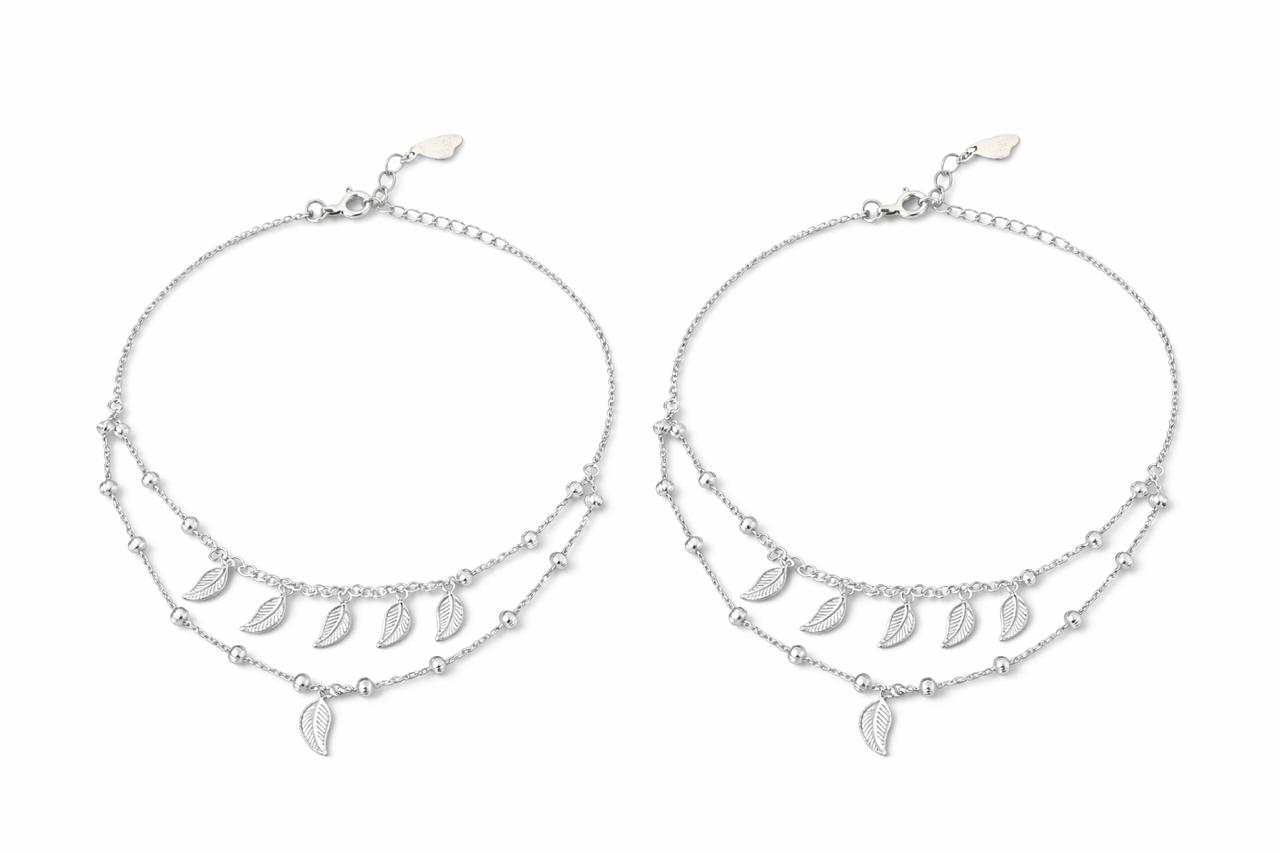 Two silver layered anklet with leaf-shaped charm on a white background