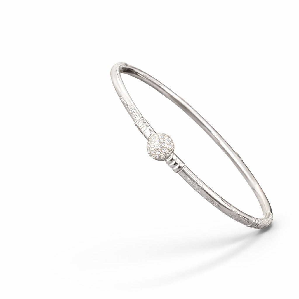 Silver bracelet with a silver pearl on a white background