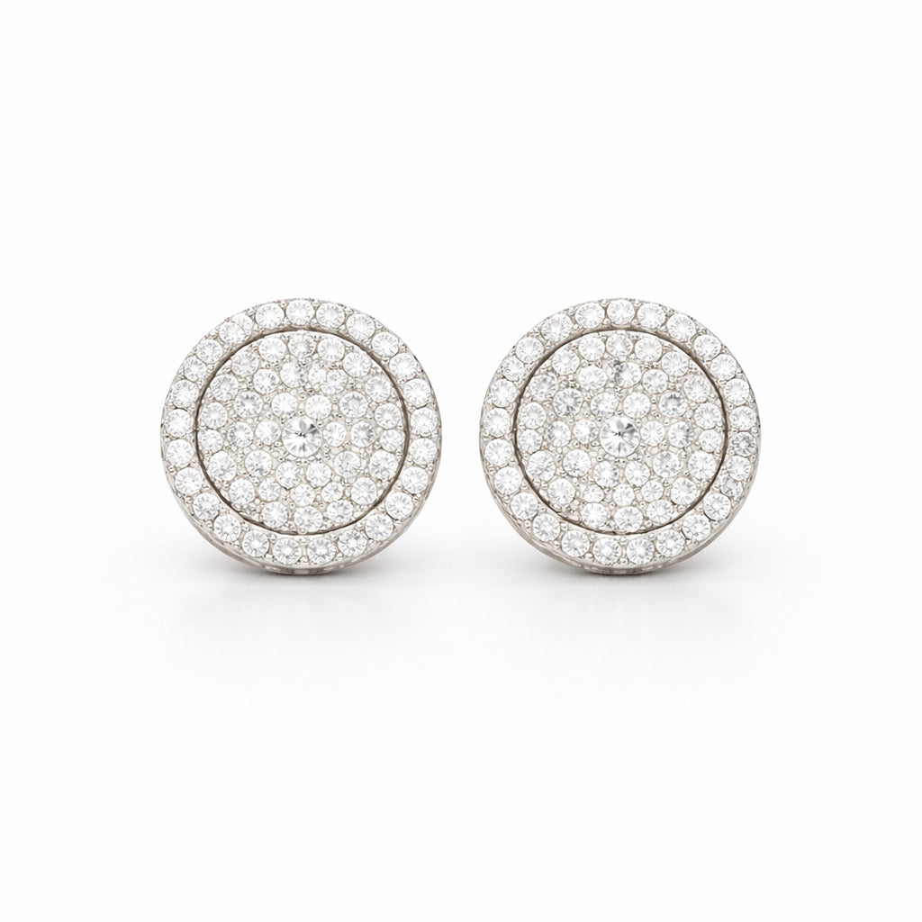 Pair of round earrings with diamond-like stones on a white background