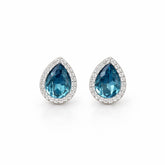 Pair of blue teardrop earrings on a white background
