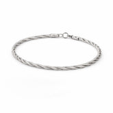 Silver braided bracelet on a white background