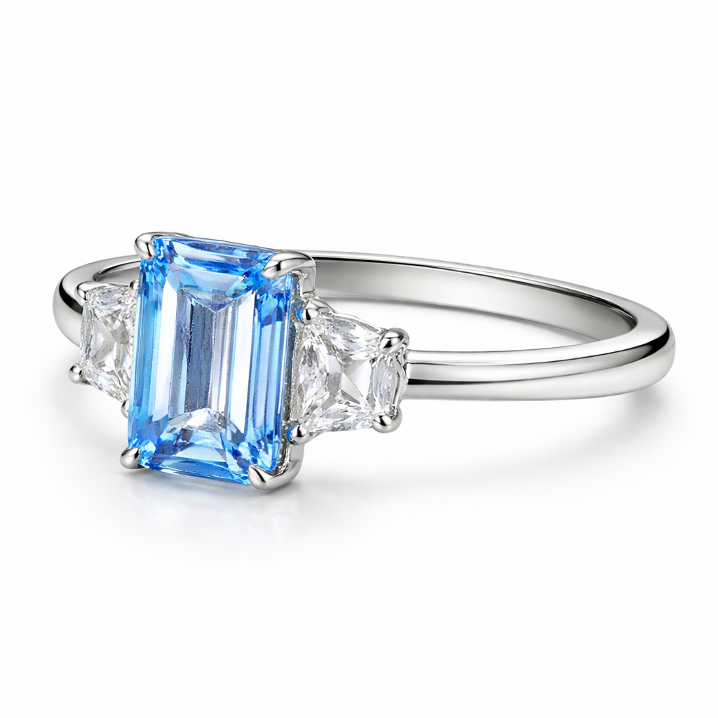 Zaviraa Emerald Cut Aquamarine Three Stone Engagement Ring for Women – 925 Sterling Silver Finish with Trapezoid Moissanite Accents | Celebrity Style Proposal Ring