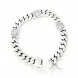 Silver chain bracelet with engraved design on a white background