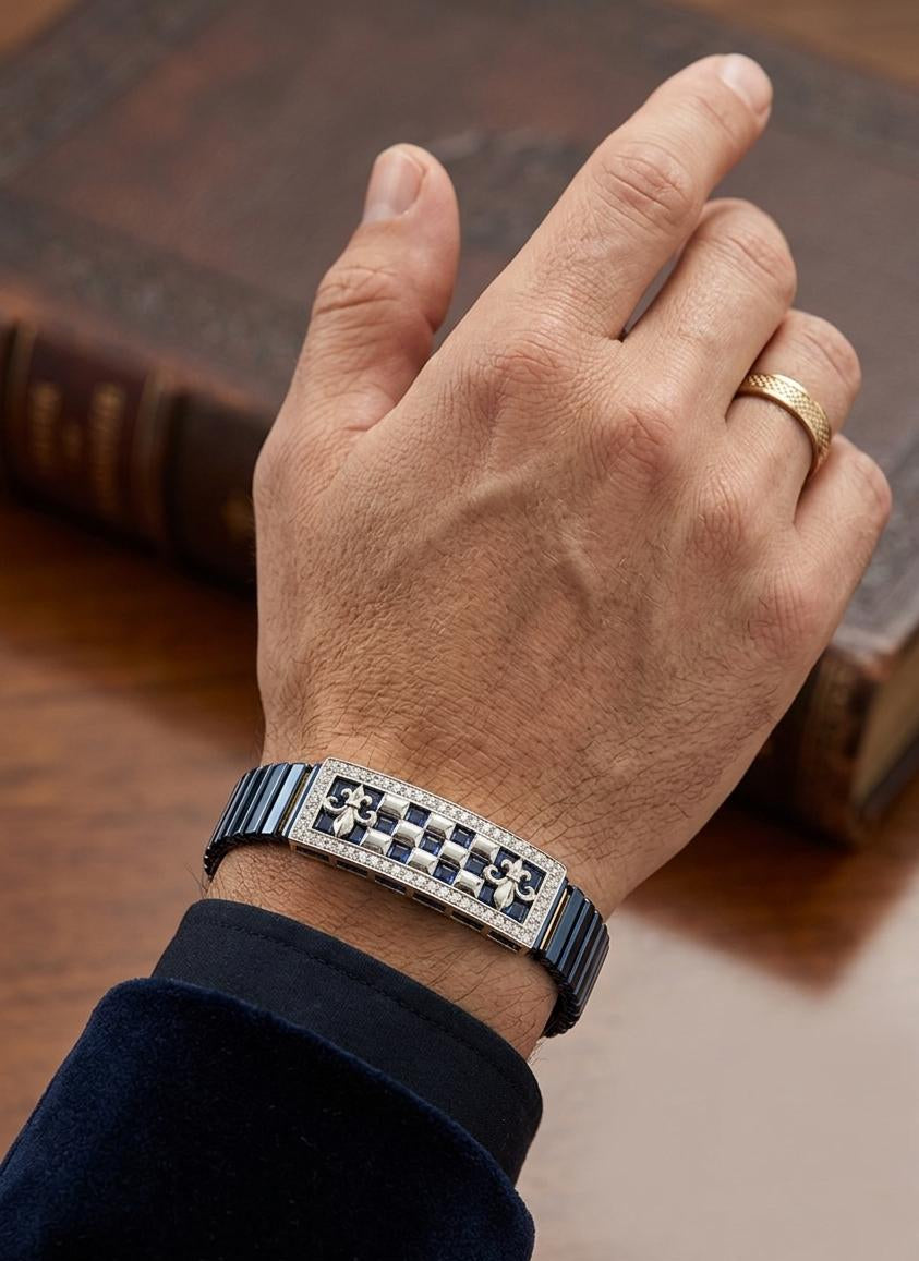 Hand wearing a bracelet with a checkered pattern on a wooden surface