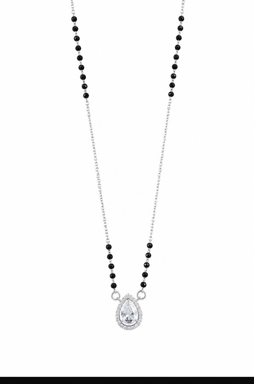 Necklace with black beads and a teardrop-shaped pendant on a white background