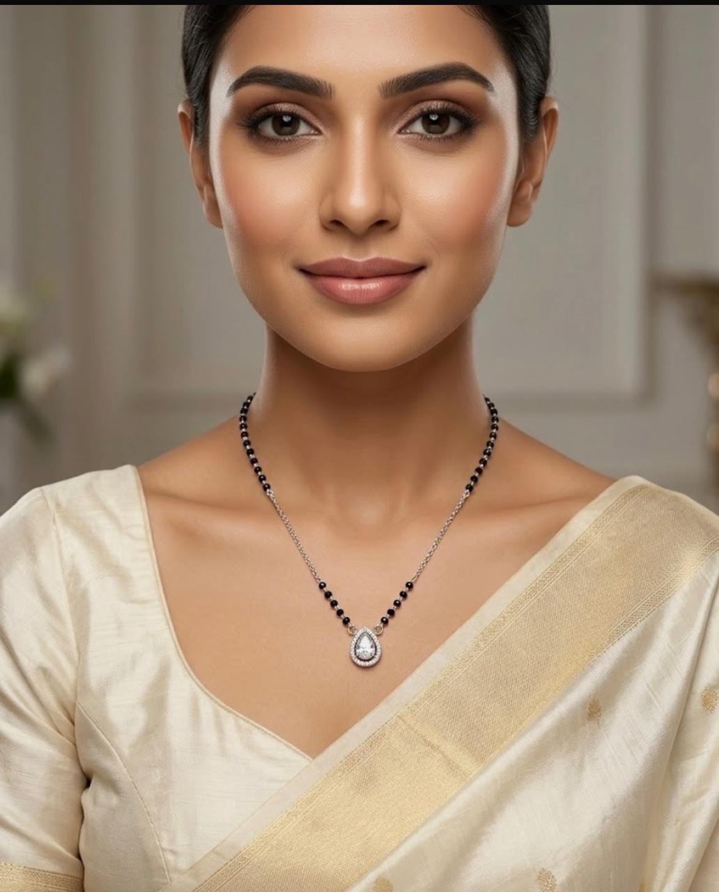 Woman wearing a necklace with a neutral background