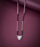 Necklace with a heart-shaped pendant on a purple background