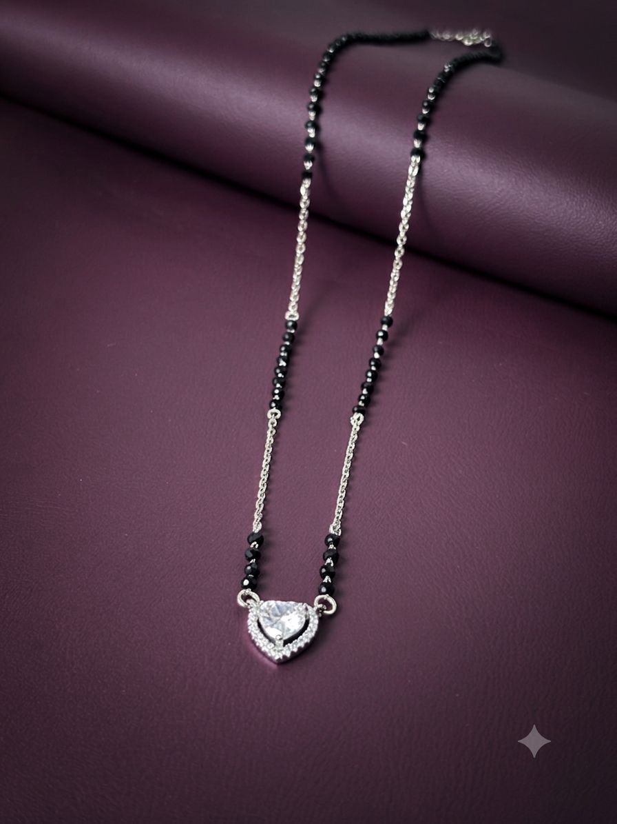 Necklace with black beaded chain and heart-shaped pendant