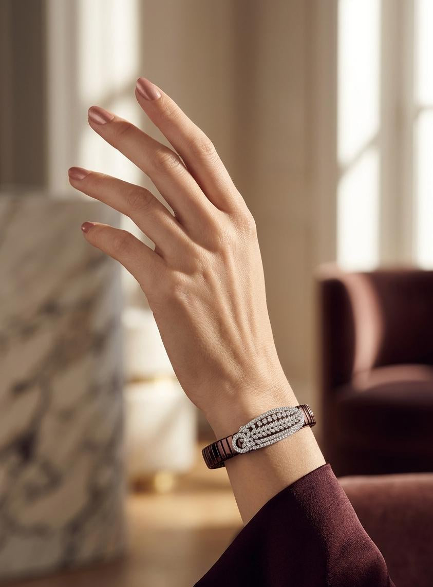 Hand wearing a bracelet with a blurred indoor background