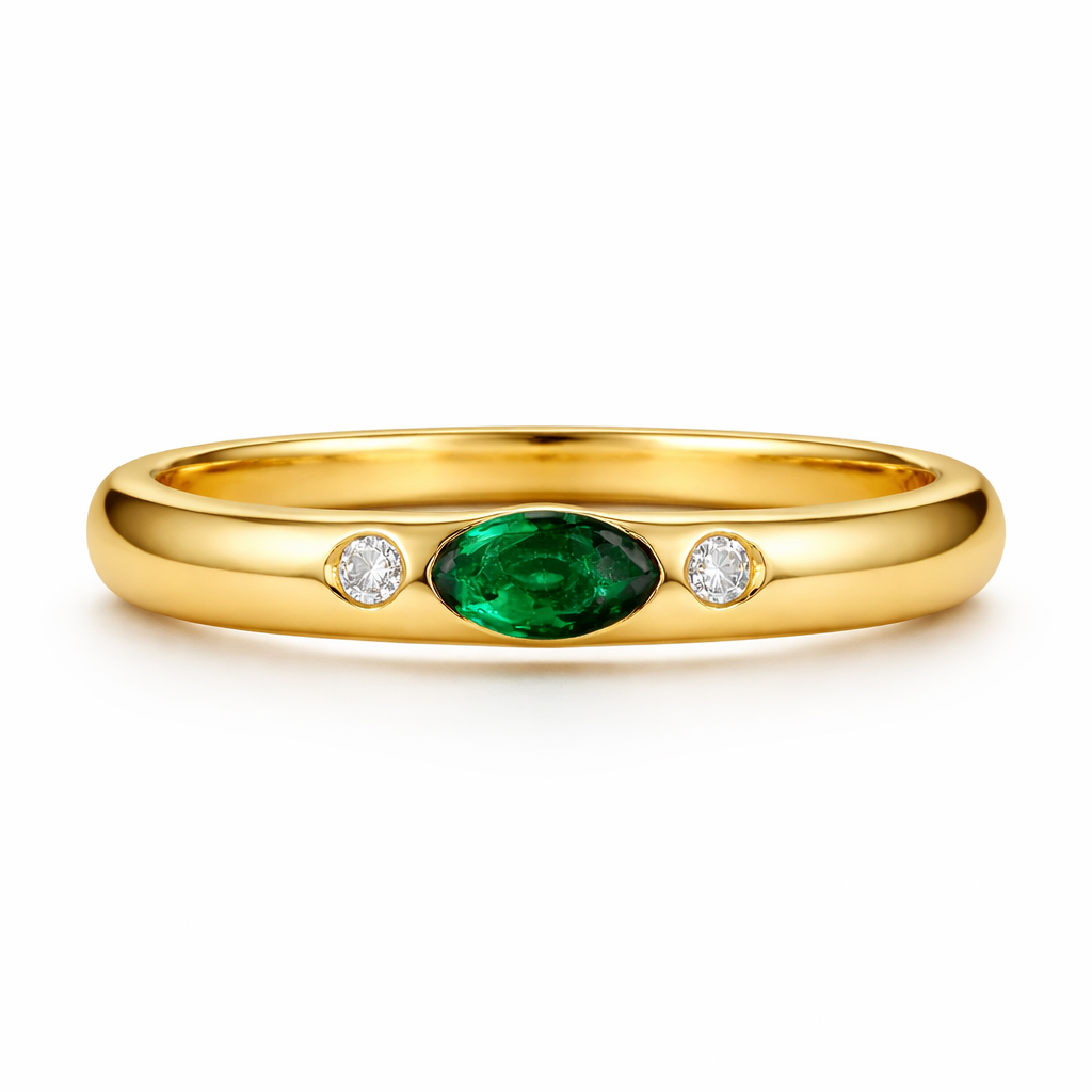 Gold ring with a green gemstone and two diamonds on a white background