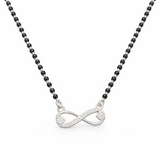 Necklace with an infinity symbol pendant on a white background