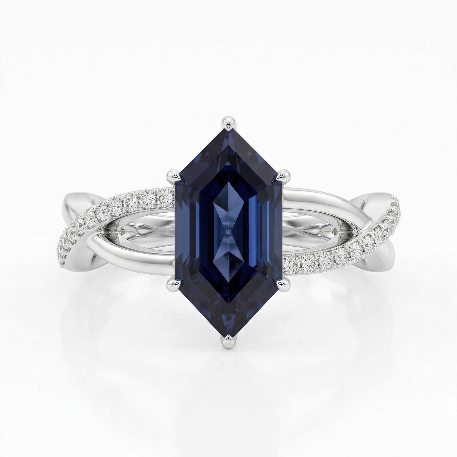 Ring with a blue gemstone and white metal band on a white background