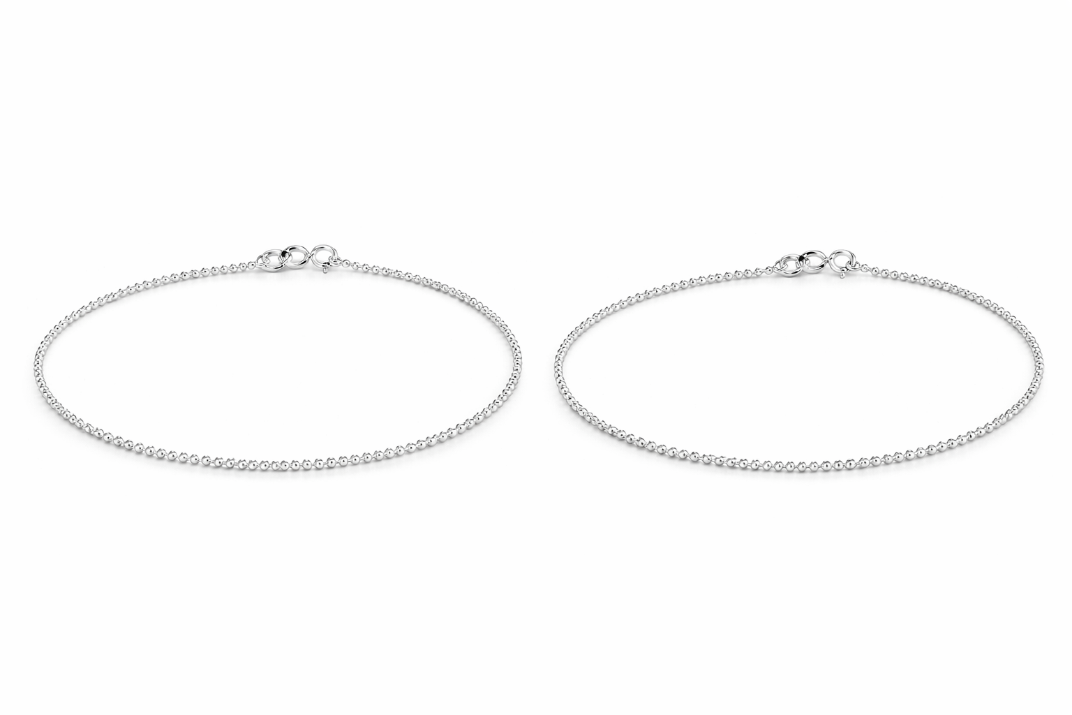 Two silver payal on a white background