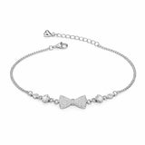 Silver bracelet with bow-shaped charms on a white background