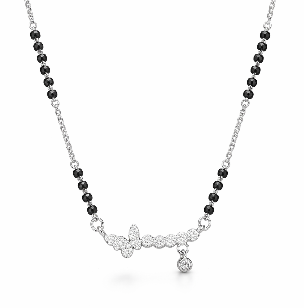 mangalsutra with black beads and silver clasp on a white background