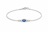 Silver payal with a blue evil eye charm on a white background