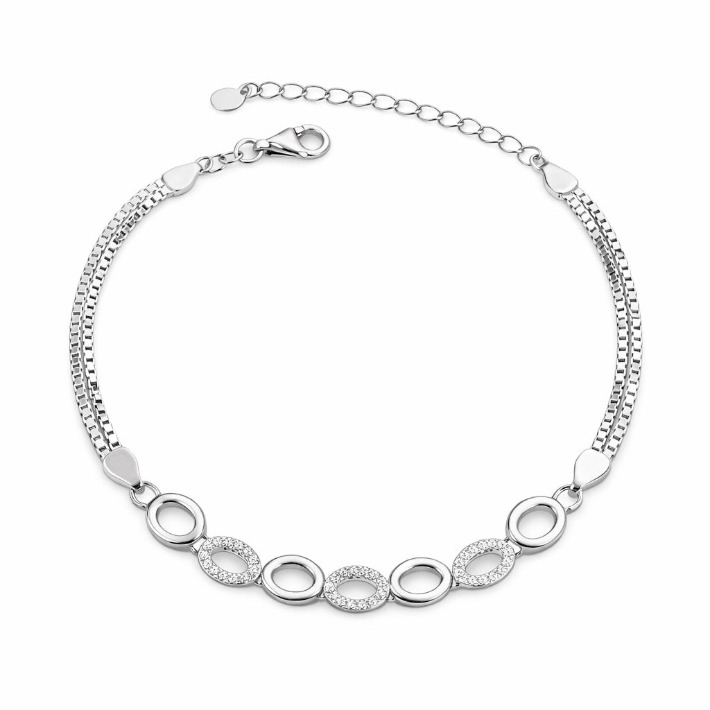 Silver bracelet with circular links on a white background